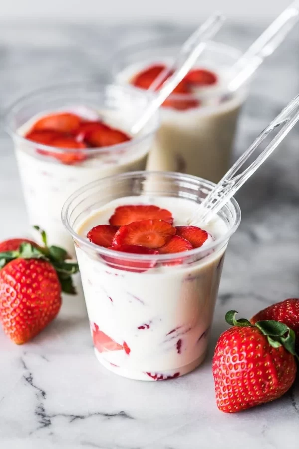 Fresas con Crema, or Strawberries and Cream, is a popular Mexican no-bake dessert made from freshly sliced strawberries mixed into a sweetened cream sauce.